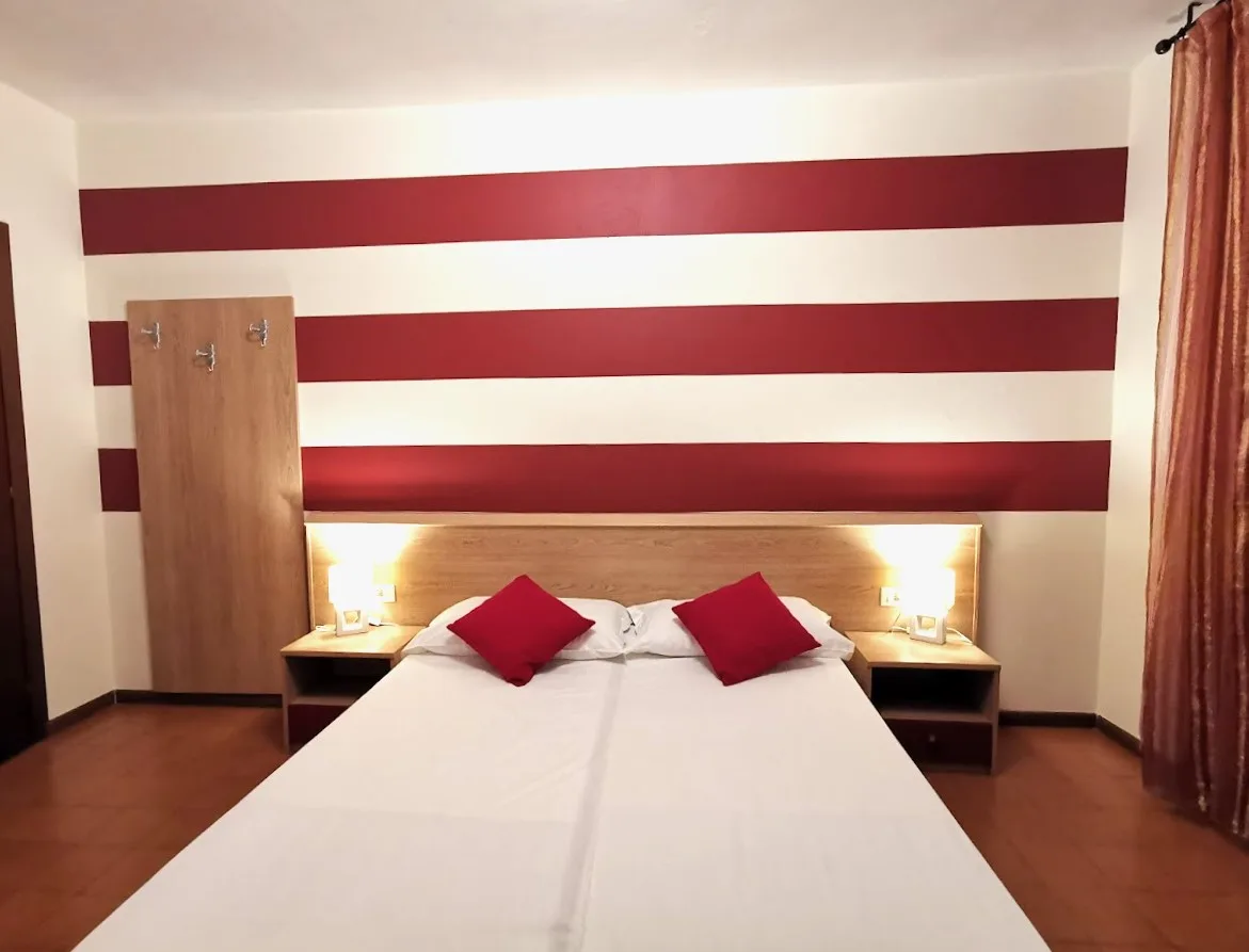 Camera famiglia con letto doppio e letto singolo